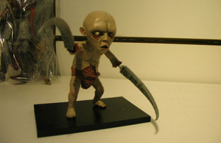 Illustration for article titled Dante's Inferno & DC Universe Online: The Toys